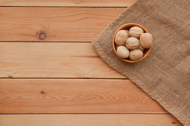 Tasty wallnuts mix on a wooden table. - Fotó, kép