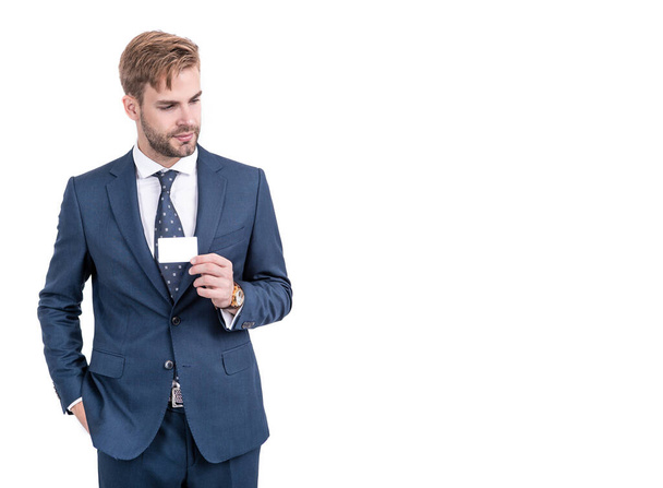 Presenting his business card. Handsome man in formal suit hold card. Identification paper - Foto, imagen