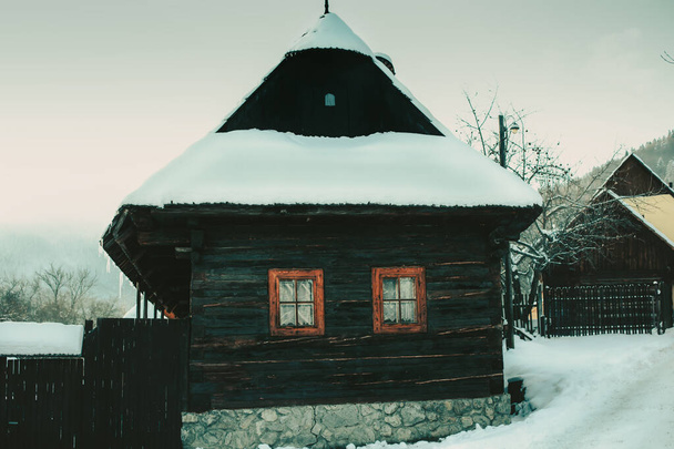 Log cabin house in Vlkolinec,traditional settlement village in the mountains. - Photo, Image