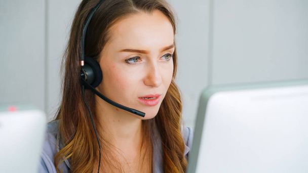 Business people wearing headset working in office - Photo, Image