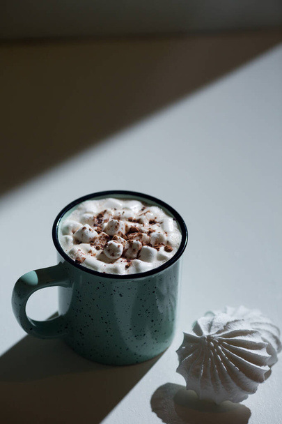 Coffee in a mug and marshmello. Hot chocolate and marshmello. - 写真・画像
