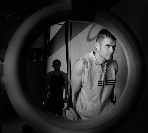 Dip rings workout man from a ring hole at gym - Valokuva, kuva