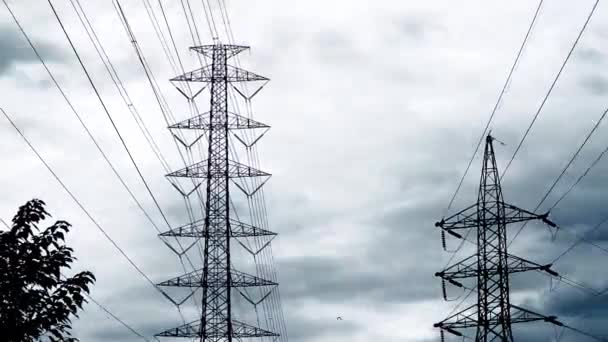 Time-lapse video of 2 electric poles with dark cloudy rain, black and white concept for background, High voltage poles and dark cloudy days move slowly through high voltage poles. - Footage, Video