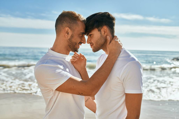 Romantic young gay couple at the beach. - Photo, Image