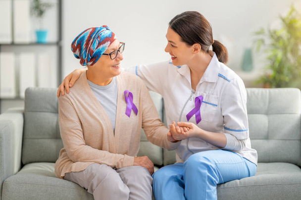 February 4 World Cancer Day. Female patient listening to doctor in medical office. Raising knowledge on people living with tumor illness. - Photo, image