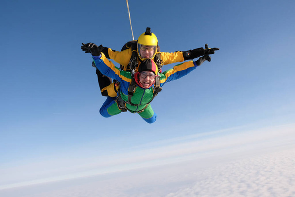 Skydiving. Tandem jump. Two guys are flying in the sky. - Photo, Image