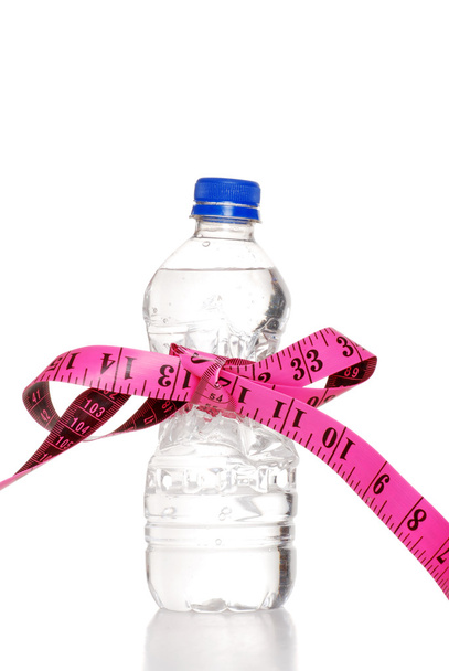 Tape measure bow on water bottle - Foto, afbeelding