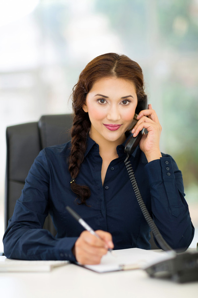young office worker talking on landline phone - Photo, image