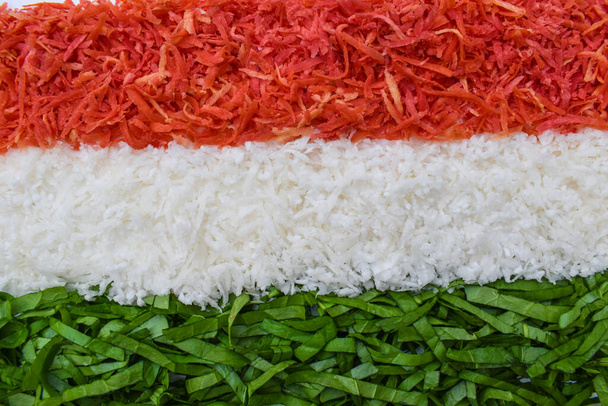 Indian republic day theme Indian flag depicted by food. Salad of fresh raw grated carrot, radish and spinach - Photo, Image