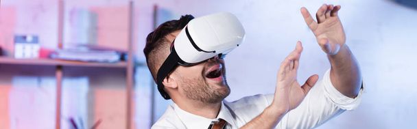 astonished architect gesturing while using vr headset, banner - Фото, зображення