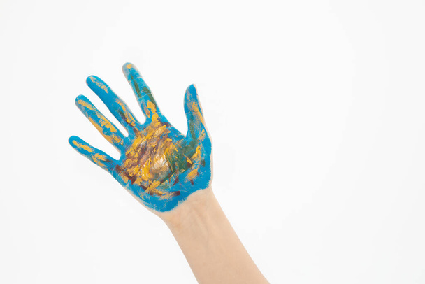 A top view of a hand painted like the earth isolated on a white background - Fotografie, Obrázek