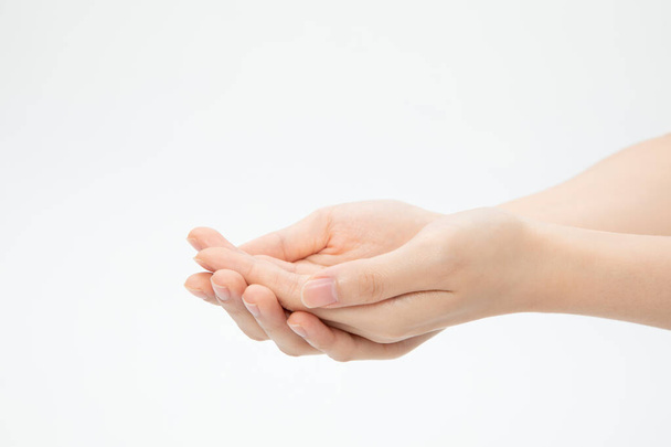 A closeup shot of hands in a begging gesture isolated on a white background - Φωτογραφία, εικόνα