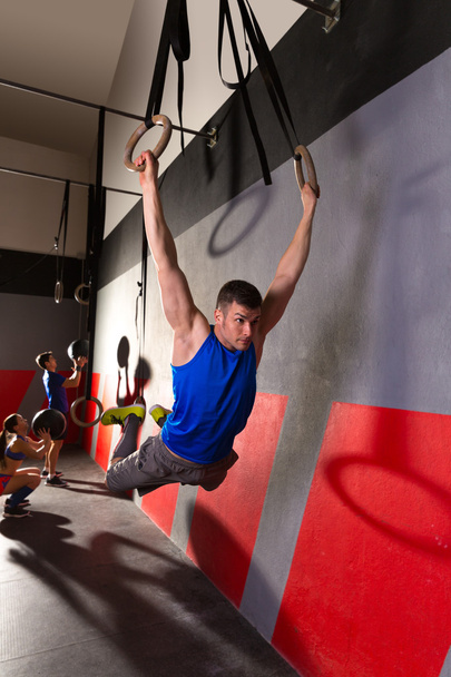 Muscle ups rings man swinging workout at gym - Foto, Bild
