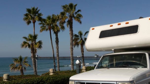 Motorhome trailer or caravan for road trip. Ocean beach, California USA. Camper van, RV motor home. - Photo, Image