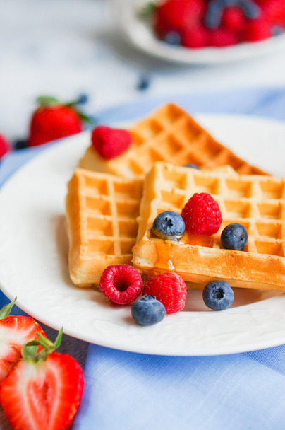 Belgian waffles with berries on rustic background - Photo, image