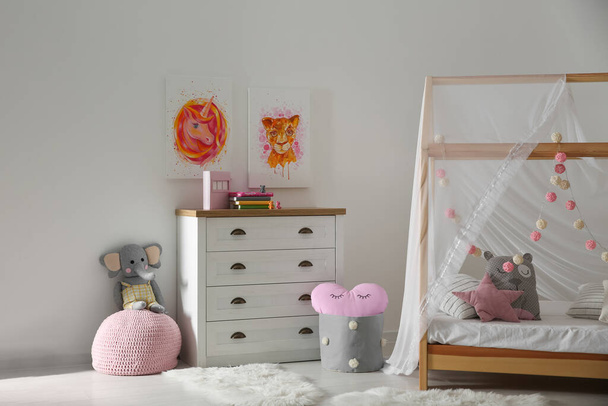 Cute pictures and and stylish furniture in baby room interior - Фото, зображення