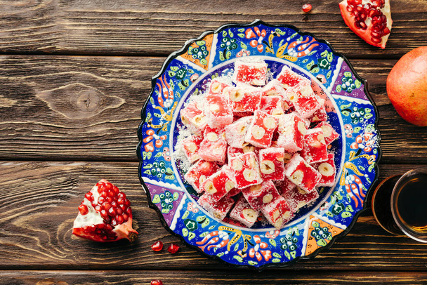 Turkish Delight. Eastern sweets with pomegranate and hazelnuts. - Photo, Image
