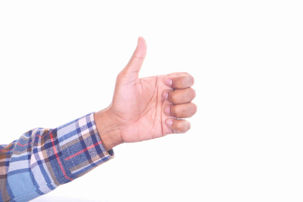 άνθρωπος χέρι δείχνει ένα αντίχειρα-up σε λευκό φόντο  - Φωτογραφία, εικόνα