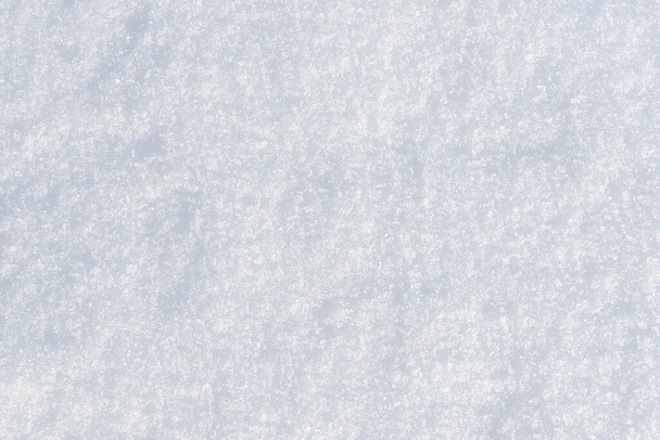 White clean shiny snow background texture. fresh snow  seamless texture. snowy surface closeup - Photo, Image