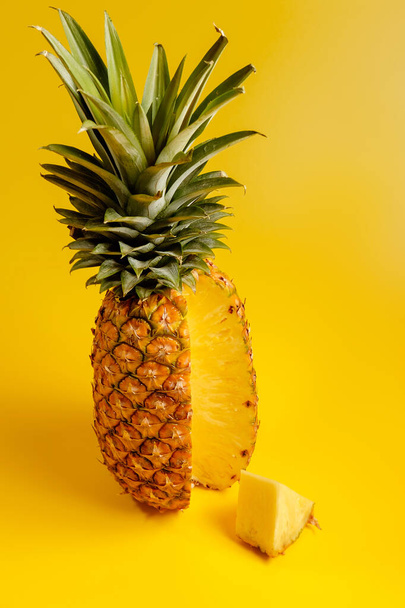 pineapple on yellow background - Valokuva, kuva