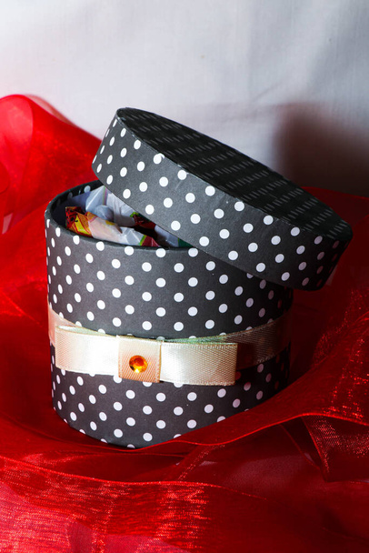 Gift box with red ribbon around - Photo, Image