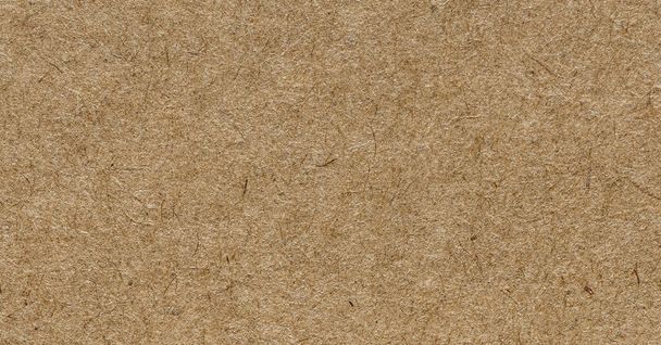 Kraft packaging paper texture, macro shot. Sharp and detailed surface. Blank brown paper. - Photo, Image