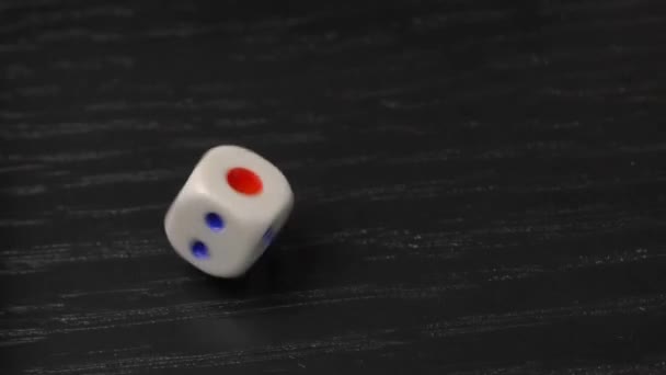 The hand turns the dice on the wooden table. Close-up - Footage, Video