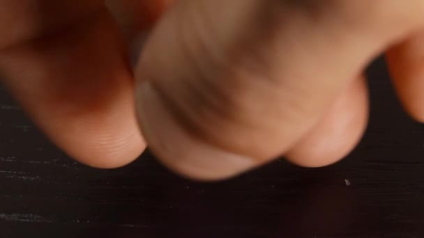 The hand throws two dice on the wooden table. Close-up - Footage, Video
