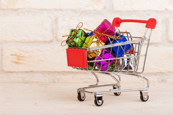 Gift boxes in a shopping trolley - Photo, Image