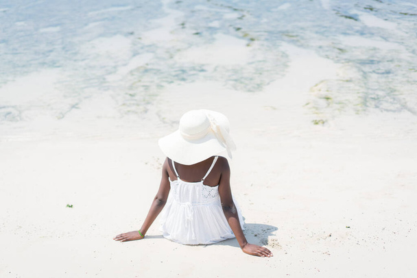Beautiful young black African American woman on tropical beach - Zdjęcie, obraz