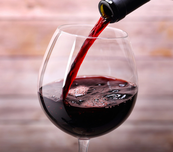 Pouring red wine into glass - Photo, Image