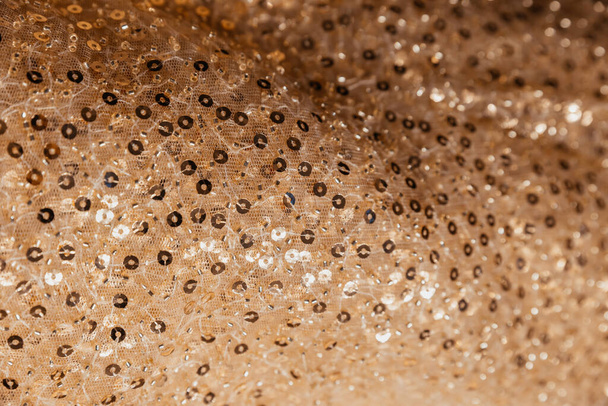 The textured background of gold sequins - Photo, Image
