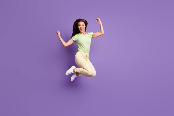 Full length body size view of her she nice attractive pretty lucky cheerful cheery girl jumping having fun celebrating attainment isolated bright vivid shine vibrant lilac violet color background - Photo, image