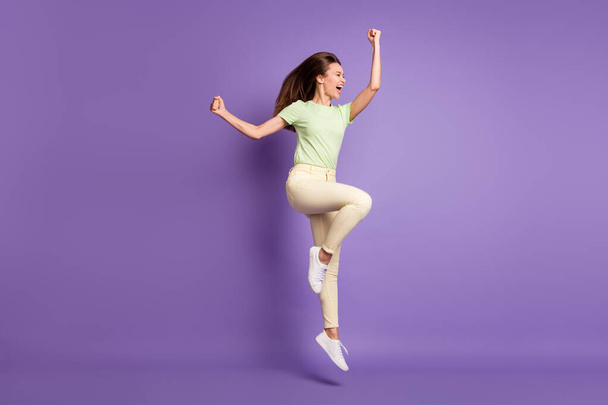 Full length body size view of her she nice attractive slender overjoyed cheerful cheery girl jumping rejoicing victory triumph isolated bright vivid shine vibrant lilac violet color background - Foto, immagini