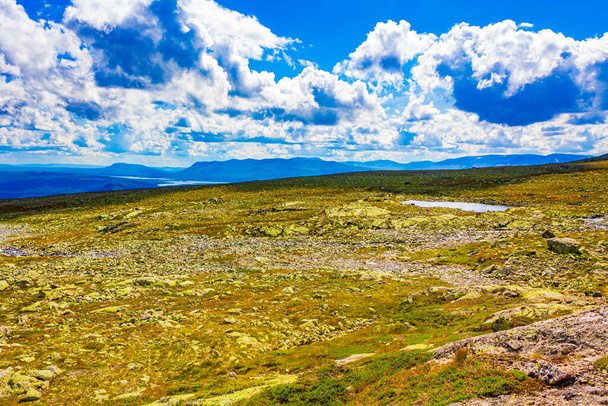 Amazing norwegian landscape with Boulders and lake at the summit on the mountain top in Vang i Valdres Norway. - Foto, Bild