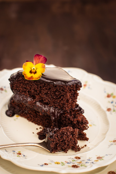 Chocolate cake decorated with flower - Фото, зображення