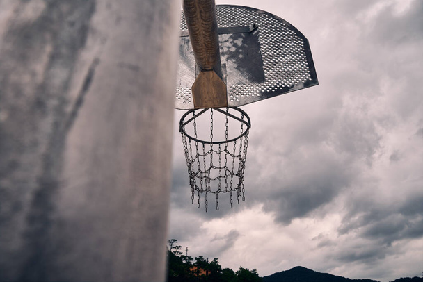 Metal basketball baskets abandoned in nature surrounded by forests                                - Photo, Image