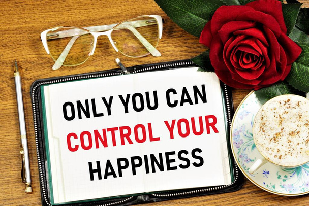 Only you can control your happiness. Text inscription of inspiration in the planning notebook. Satisfaction with the conditions of being, meaningfulness of life, fulfillment of vocation and self-realization. - Foto, Bild