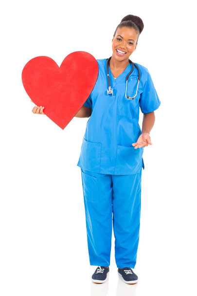 young african american doctor holding heart - Foto, immagini