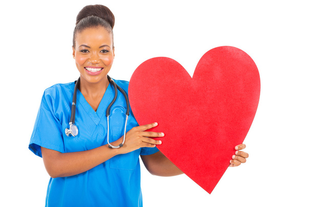 african american healthcare worker with heart symbol - Fotó, kép