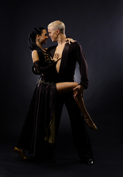 Dancers against black background - Фото, изображение