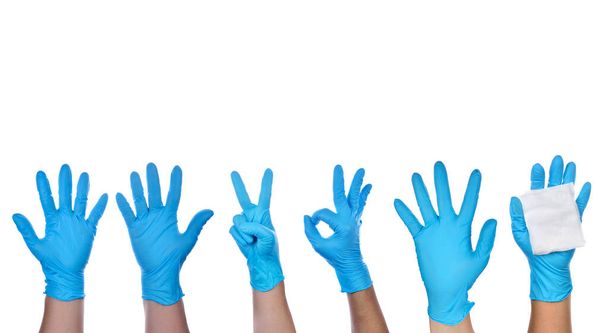 青いラテックスの手袋を身に着けている医療の手 - 写真・画像