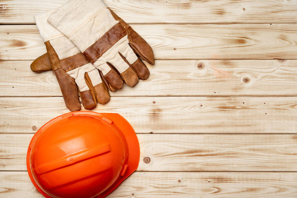 Hardhat and gloves of construction worker top view - 写真・画像