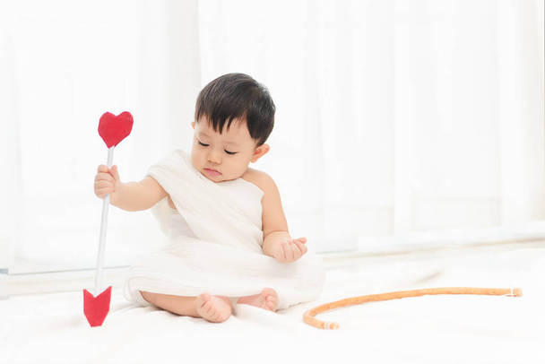 Cupid funny,  Little asian boy with Cupid costume and wings for Valentine's festival day. - 写真・画像