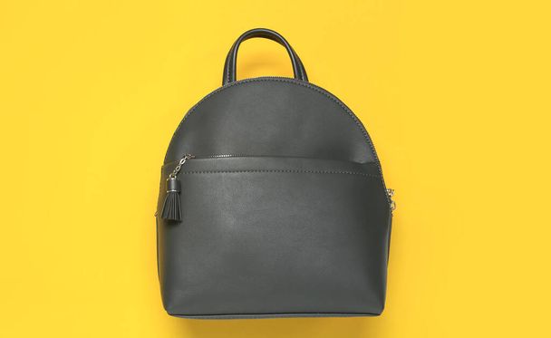 Stylish urban backpack on yellow background, top view - Fotoğraf, Görsel