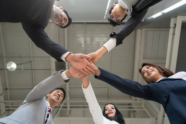 business people are stacking their hands together in circle, shows together, uniting concept, - Foto, immagini