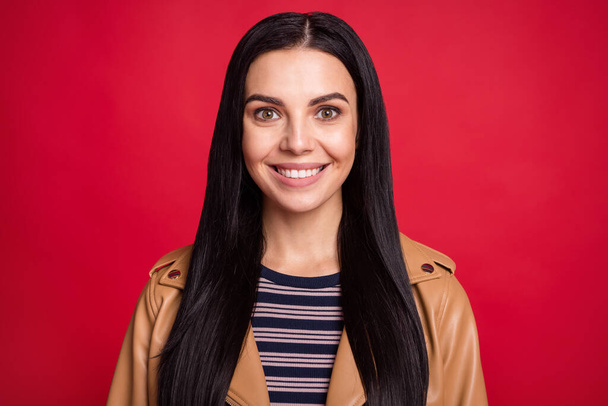 Photo of satisfied person smile look camera wear striped jumper isolated on bright red color background - Foto, immagini