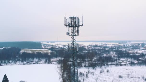 Snow falling at 5g antenna in slow motion. Telecommunication tower - Footage, Video