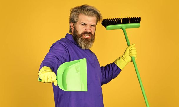 he loves his job. Janitor in gloves. husband cleaning house. Housework and domestic duty. Male janitor with cleaning supply. sweeping the floor. man cleaner. bearded man cleaning with mop - Zdjęcie, obraz
