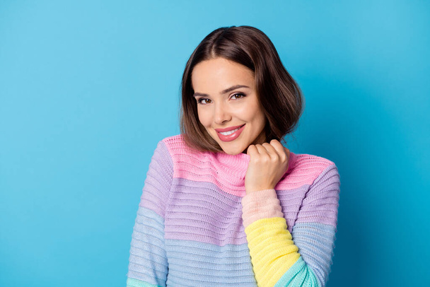 Photo of nice pretty girl touch collar look good mood in camera wear comfort pullover isolated blue color background - 写真・画像